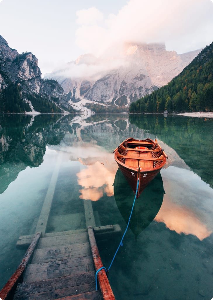 on-the-pier-wooden-boat-on-the-crystal-lake-with-2025-03-18-21-00-15-utc 1